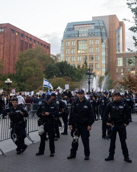 NYPD officers block off an entrance to Washington Square Park.