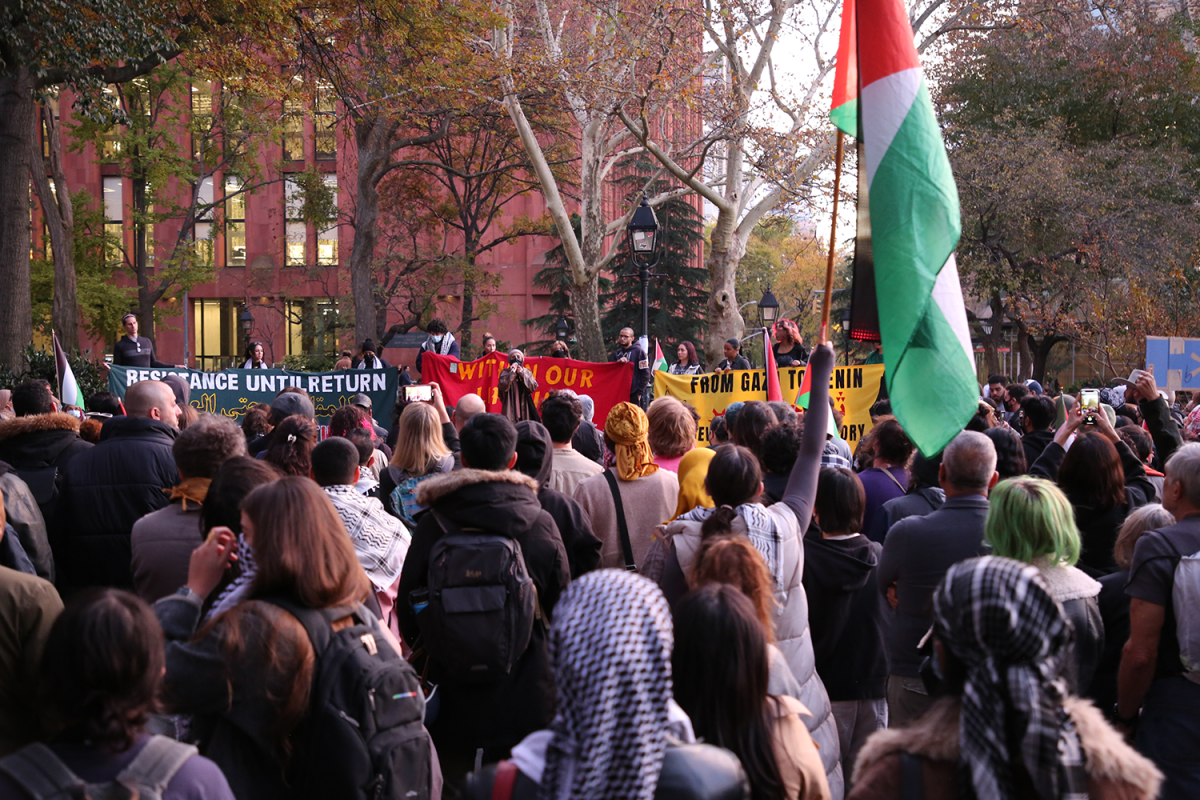 A+group+of+people+gathered+in+Washington+Square+Park+for+a+protest.