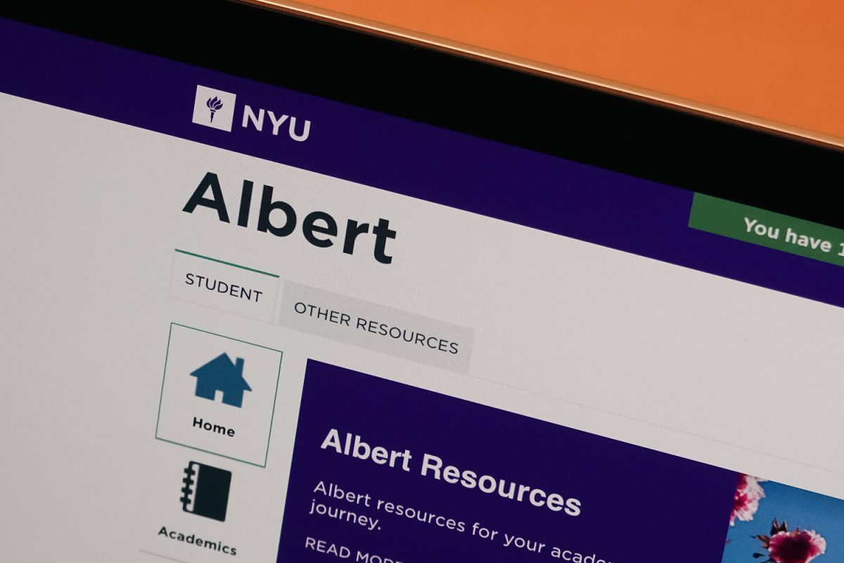 A laptop displaying the webpage of “N.Y.U. Albert” course registration system.