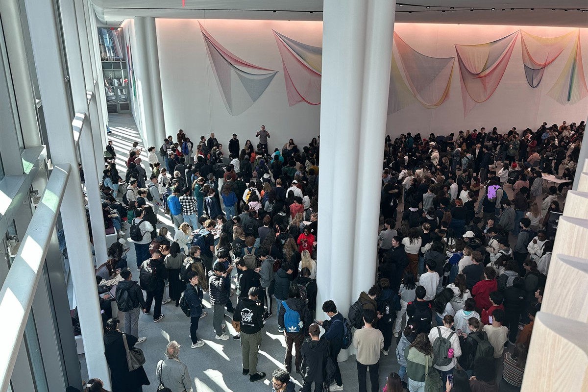 A crowd of students in a large lobby.