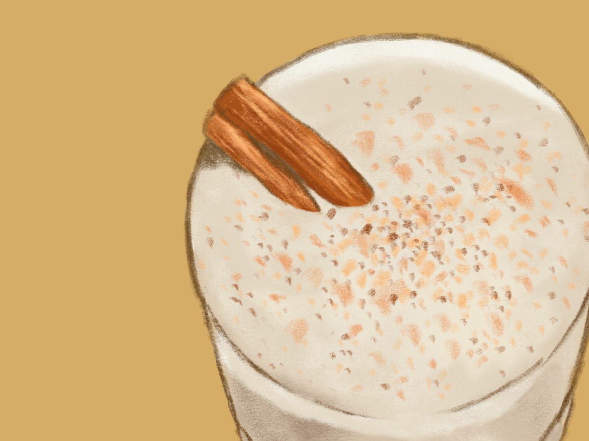An illustration of coquito, against a yellow background. The drink is white with cinnamon on top.