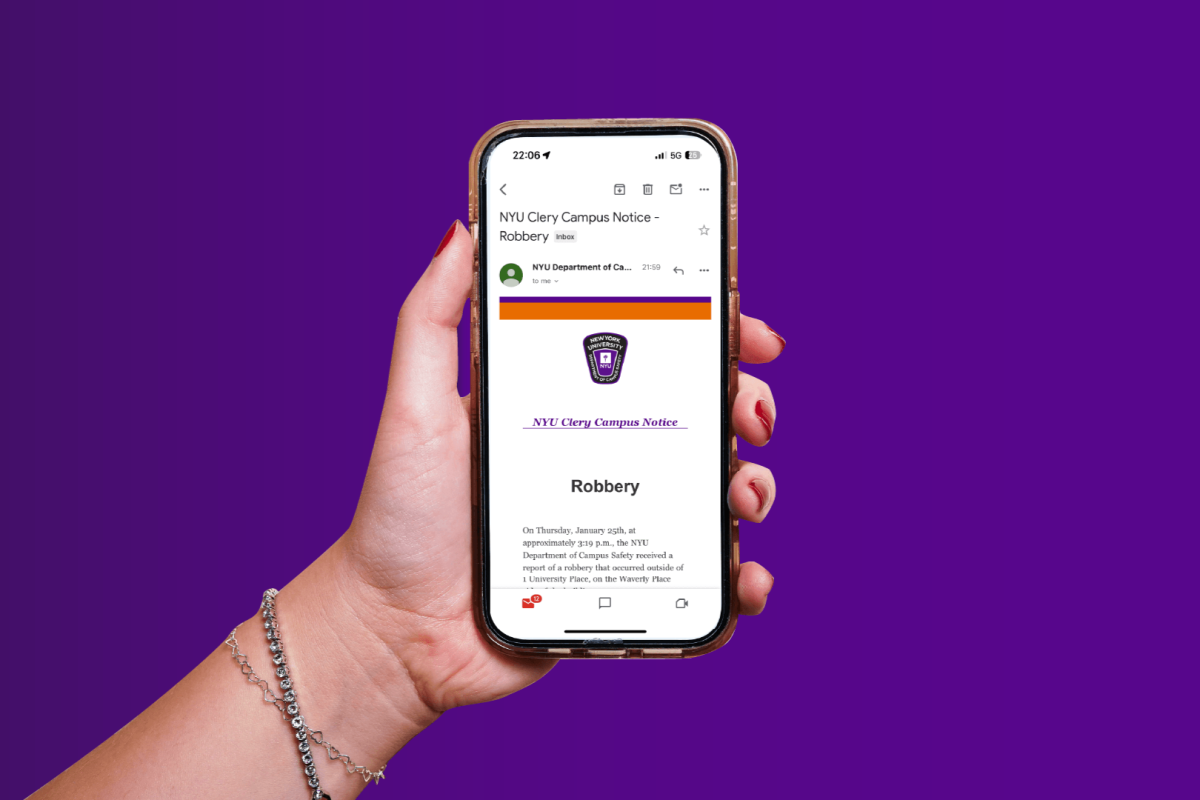 A+hand+holding+an+iPhone+with+an+email+from+NYU+Campus+Safety+reporting+a+robbery+incident+displayed+on+it+placed+in+front+of+a+purple+background.