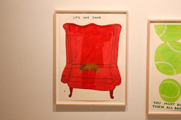 A painting of a large, red, cushioned chair with a small dog on it. Above the chair, it reads “IT’S HIS CHAIR”.