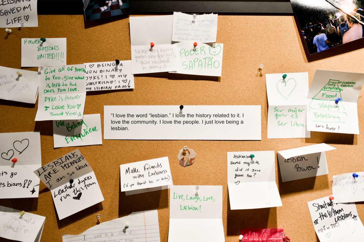 A corkboard with handwritten notes pinned on it.