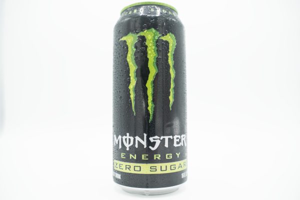 A wet black can of Monster energy drink.