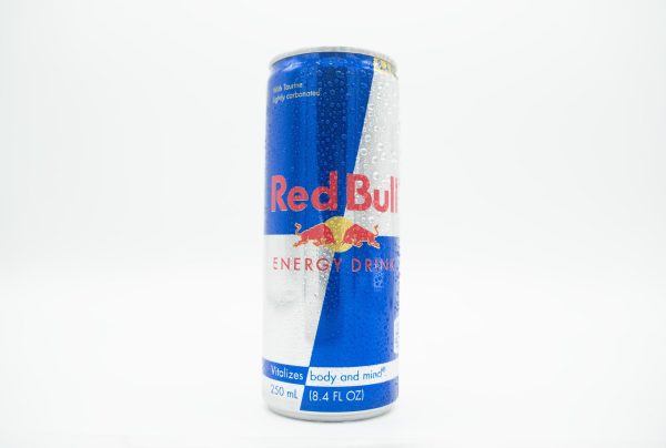 A wet blue and gray can with the Red Bull logo in red and yellow.