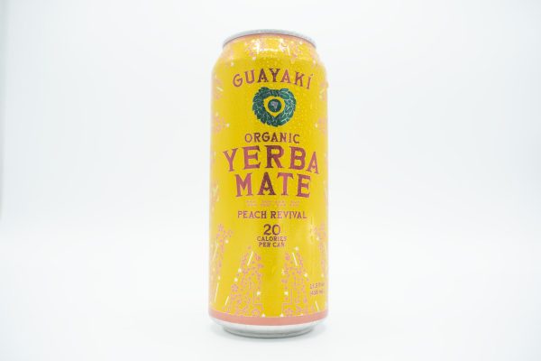 A wet yellow can of Peach Revival Yerba Mate.