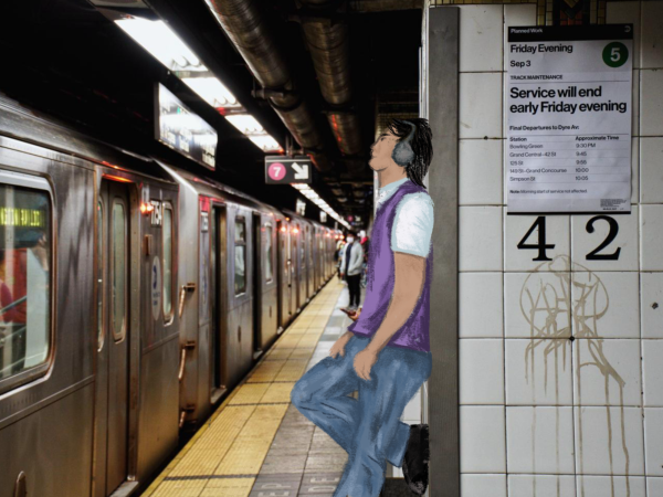 A person standing at the subway station is wearing a vest over a white T-shirt, blue jeans and gray headphones.