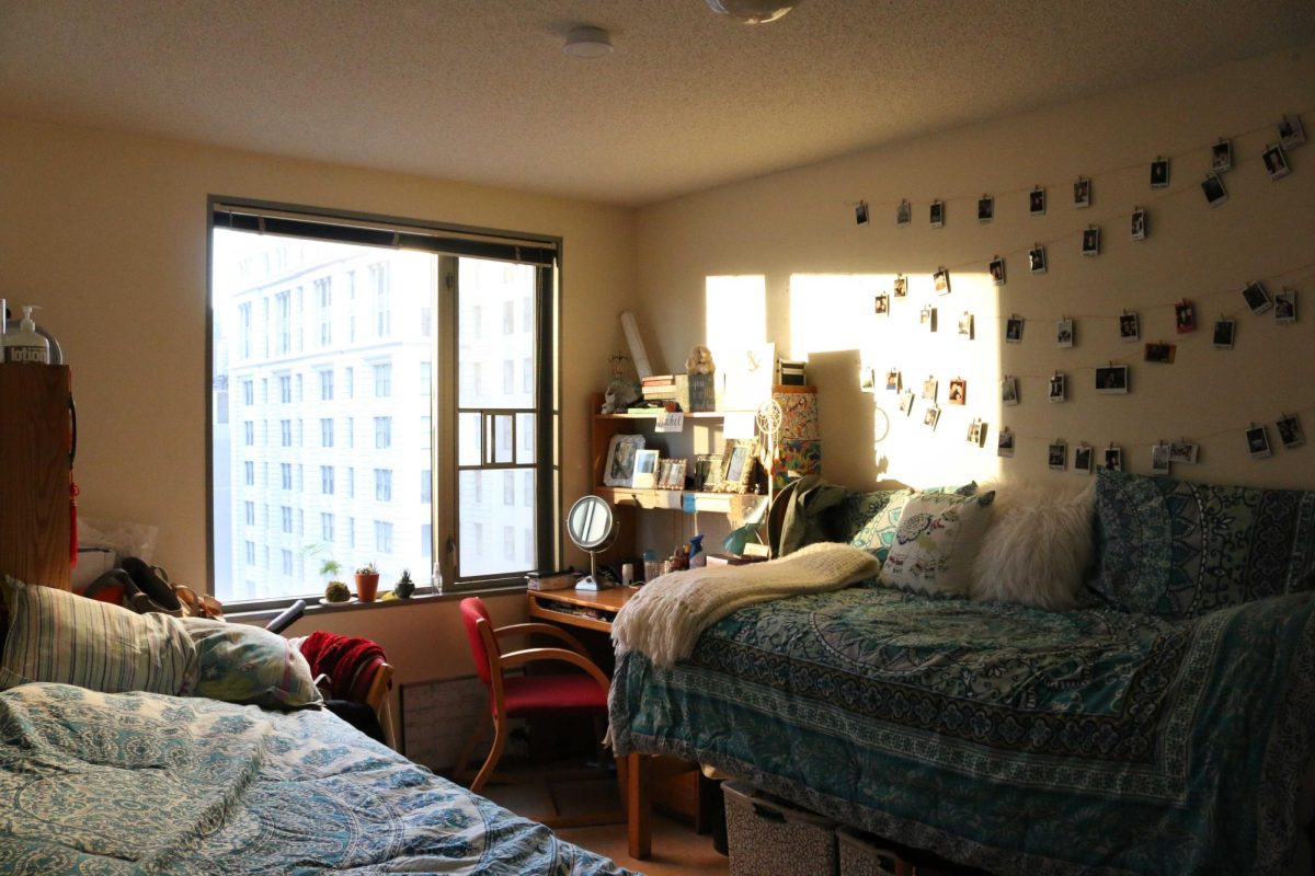 A dorm room with two beds in University Hall.
