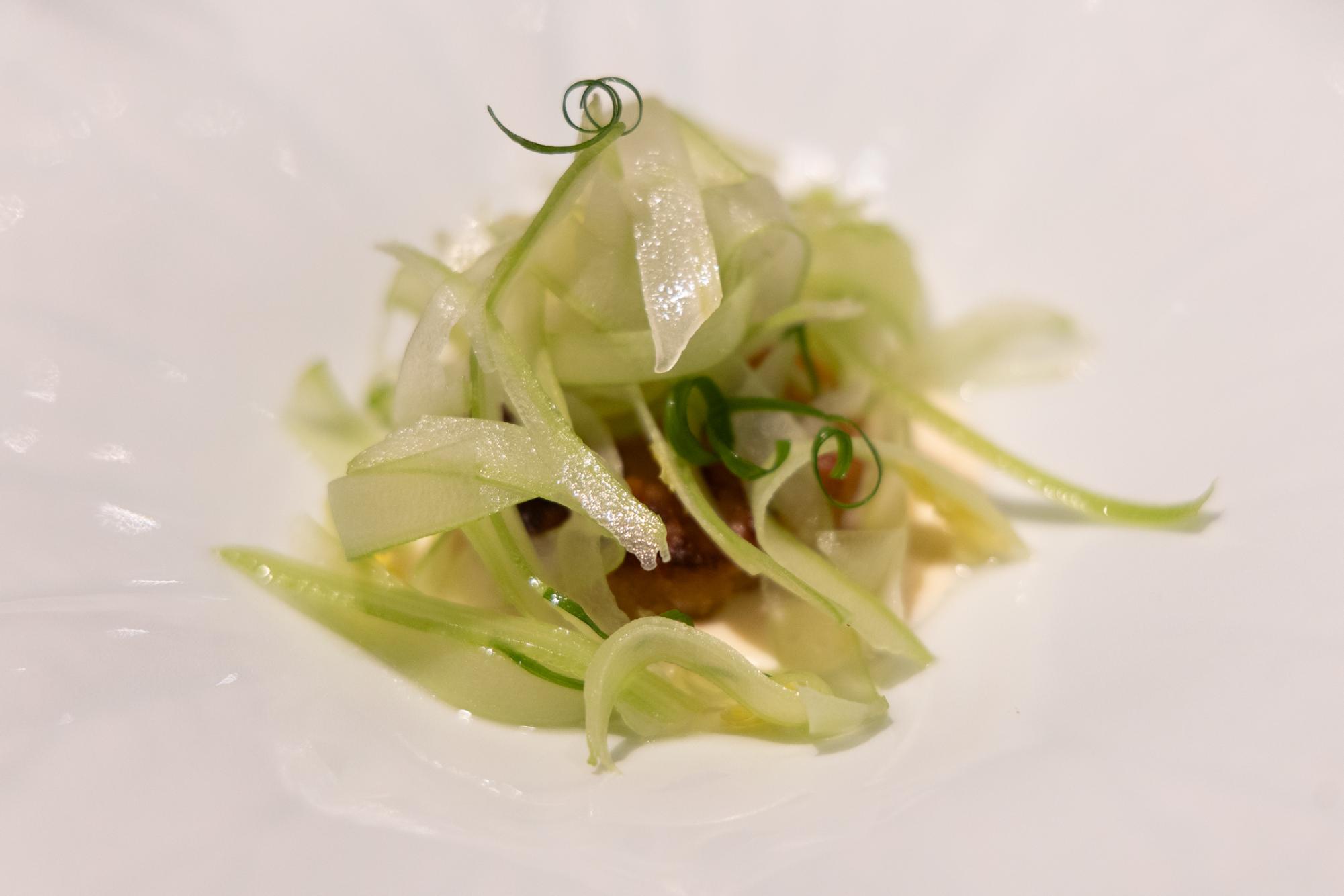 A white plate with celery.