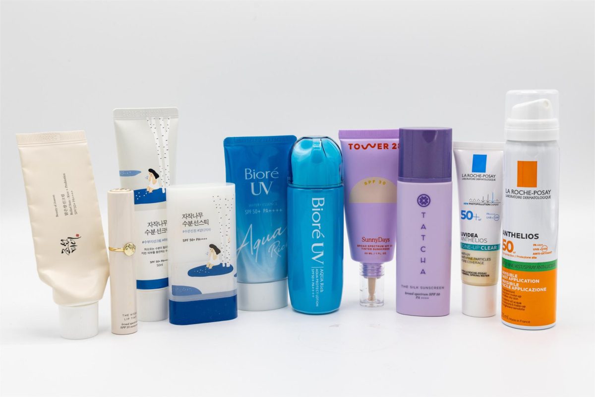 A collection of different brands of sunscreen displayed.