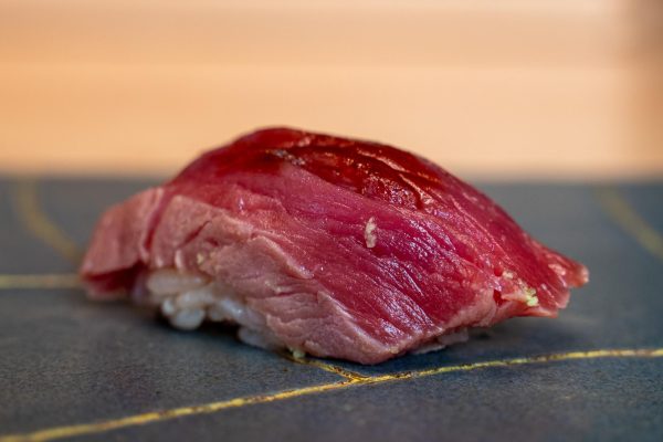 Red fish sashimi over rice.