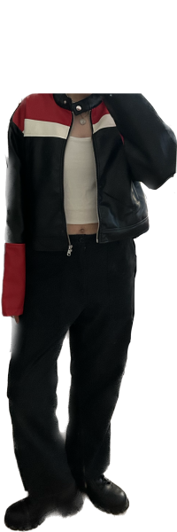 Someone wearing black pants, a white shirt and a black jacket with a black and red stripe.