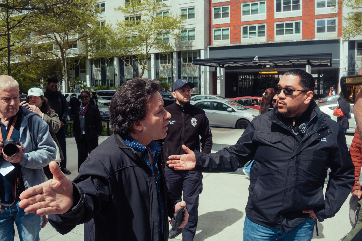 A Campus Safety officer confronts a counterprotester.