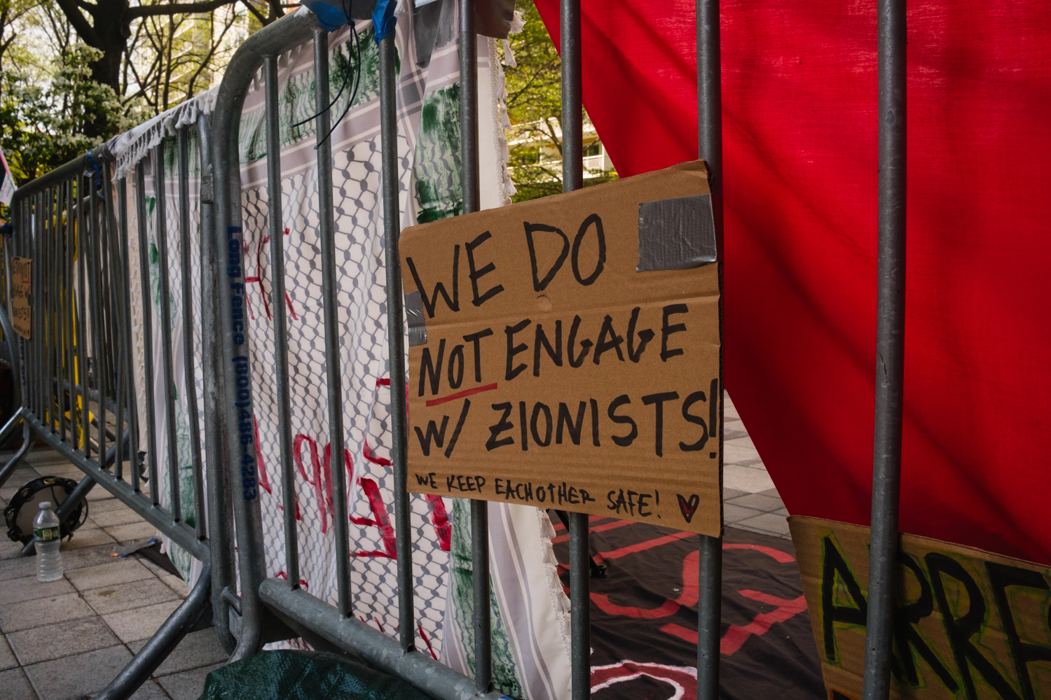A sign attached to a barricade read “We do not engage with Zionists!”