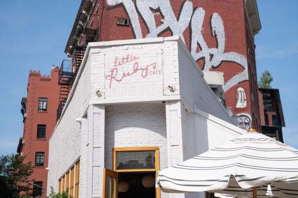 A storefront that says “Little Ruby’s Café” in a red cursive font.