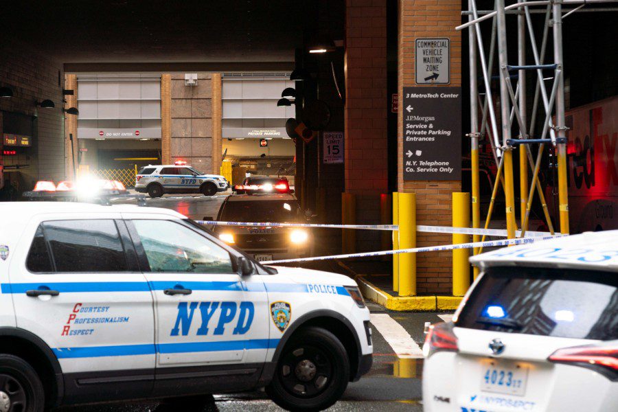 Three white N.Y.P.D cars park in front of Tandon School of Engineering.