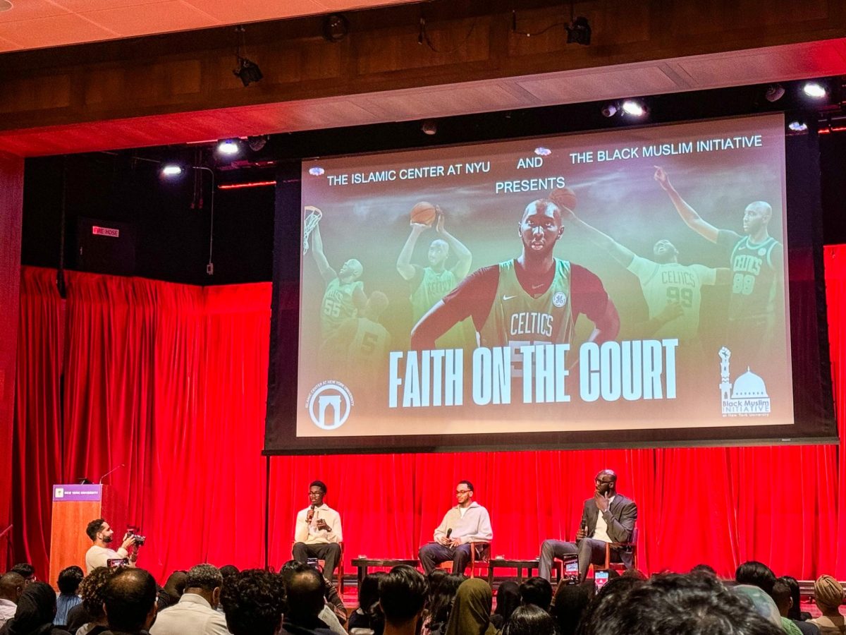 A panel of three men sit on a stage with a large screen above them projecting a photo with Celtics basketball players titled “THE ISLAMIC CENTER AT NYU AND THE BLACK MUSLIM INITIATIVE PRESENTS FAITH ON THE COURT.”