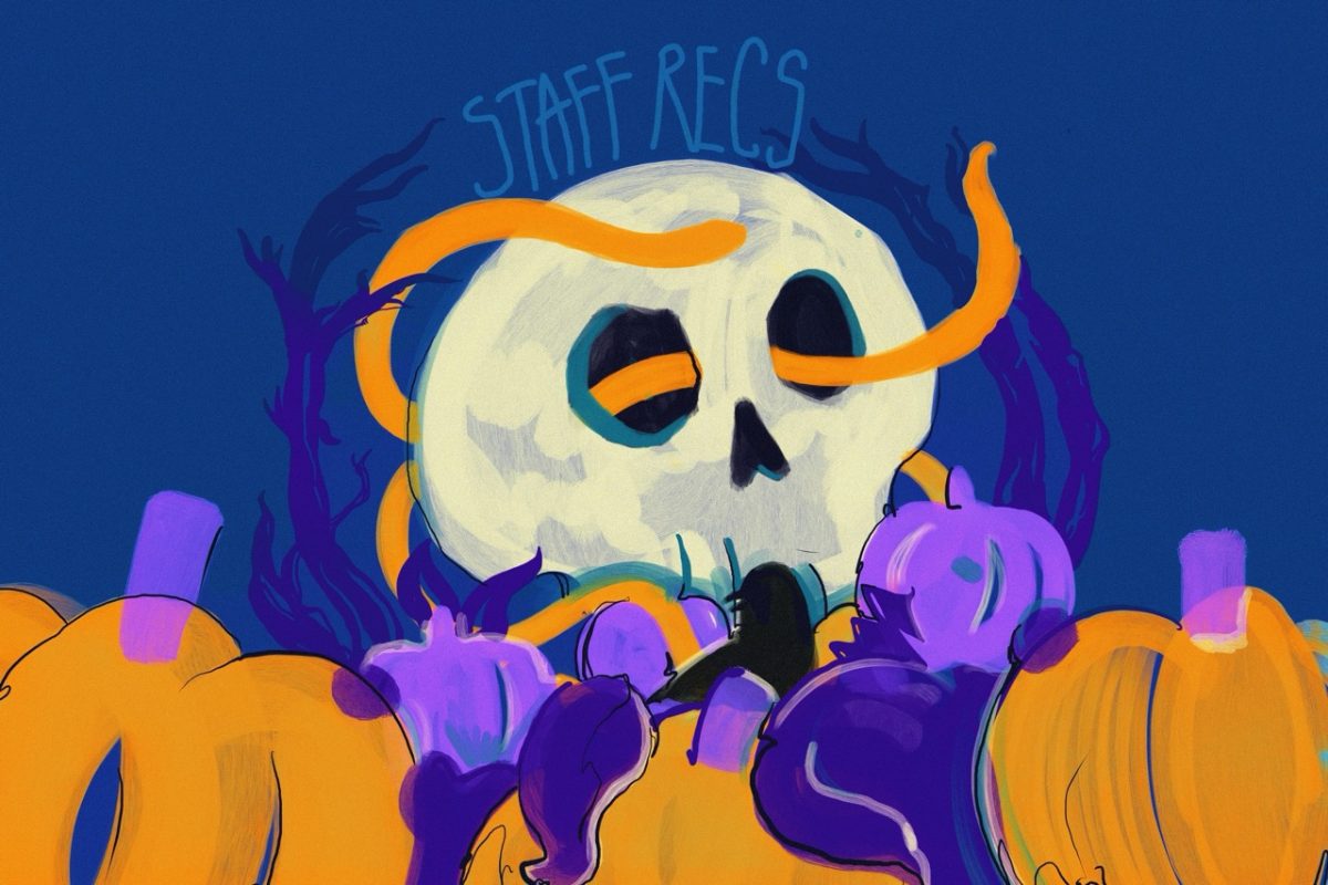 A large skull with orange vines wrapped around it. There are orange and purple pumpkins, and "STAFF RECS" is written above the skull on the dark blue background.