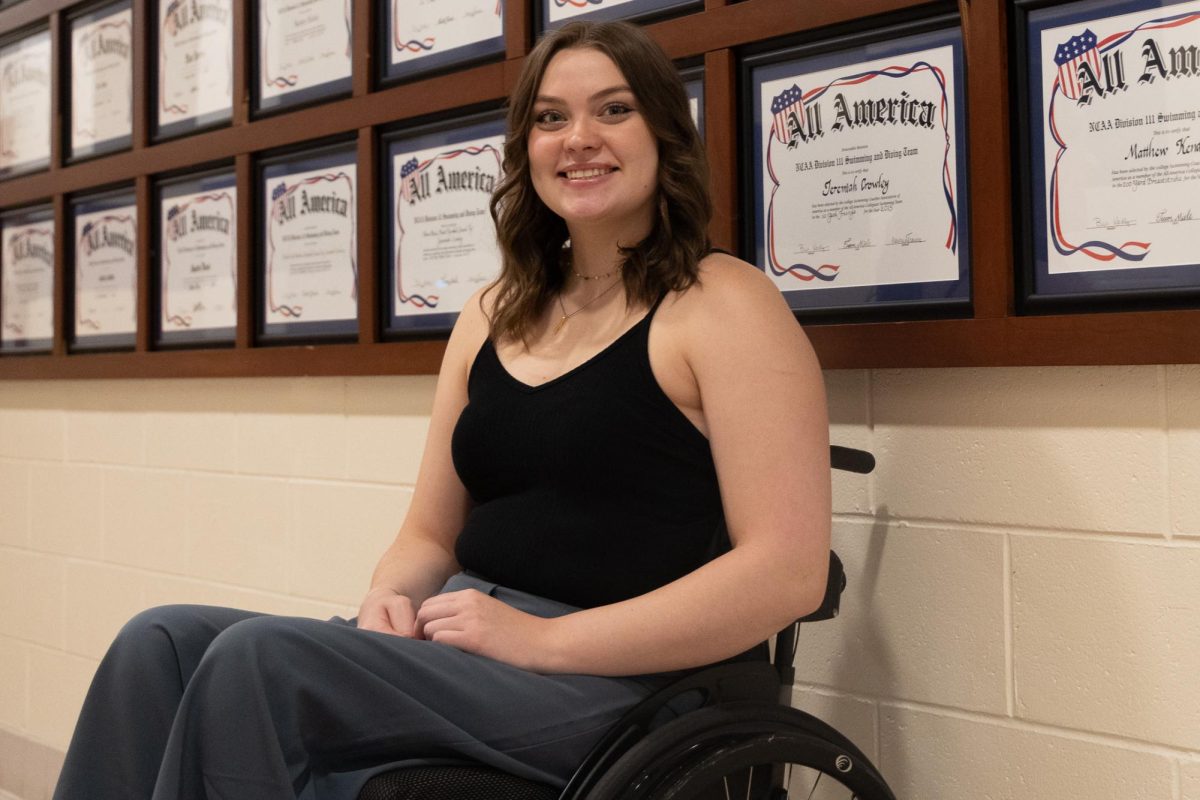 A woman in a wheelchair posing for a photo.