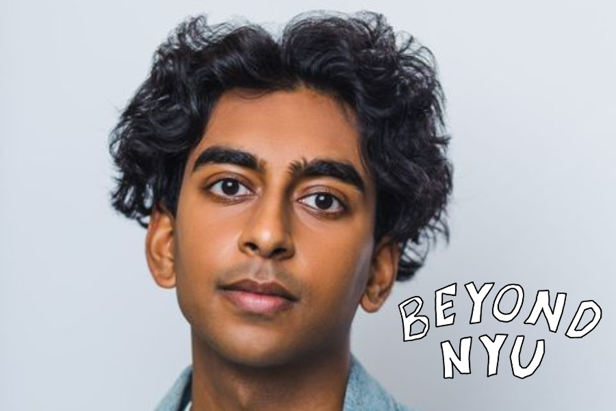 A man posing in front of a white backdrop with the words “Beyond N.Y.U.” illustrated next to him.