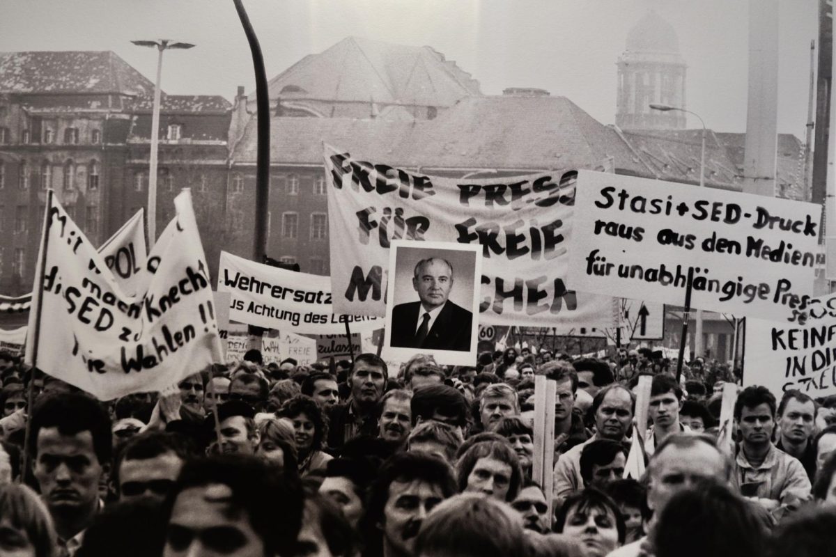 A monochromatic photograph depicting a group of German protesters.