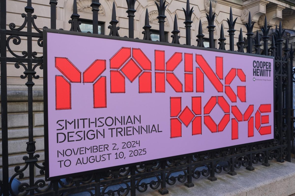 A purple sign with the phrase “MAKING HOME” and “SMITHSONIAN DESIGN TRIENNIAL, NOVEMBER 2, 2024 TO AUGUST 10, 2025,” on a black fence.