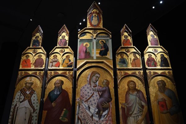 Panels of various painted saints and holy personages, all against a gold background