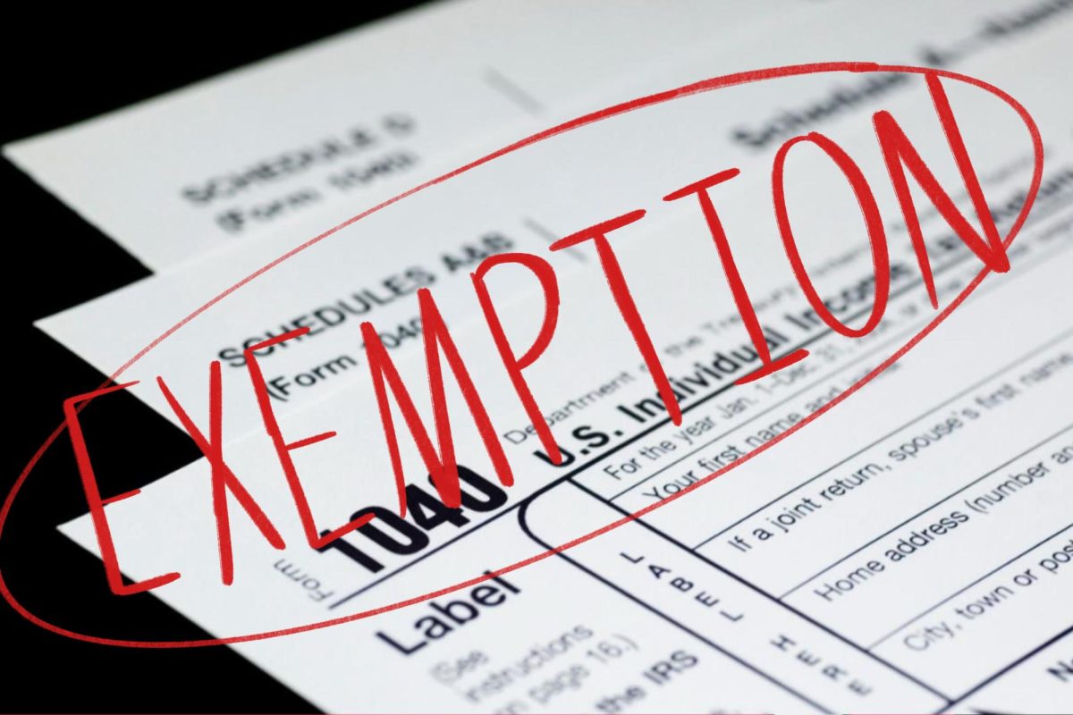 Red text reading “EXEMPTION” overlays a stack of tax forms.