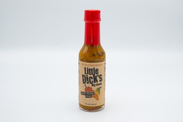 A bottle of brown hot sauce with a tan label that reads “Little Dick’s Big Flavor” and “Ghost Pepper Pear” over a logo of a red pepper and a green pepper.