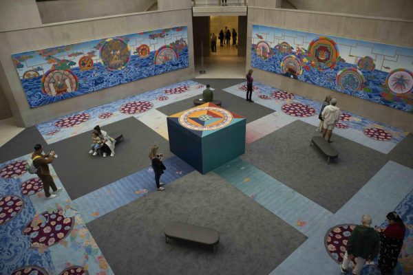 An overhead view of a room filled with colorful mandalas.