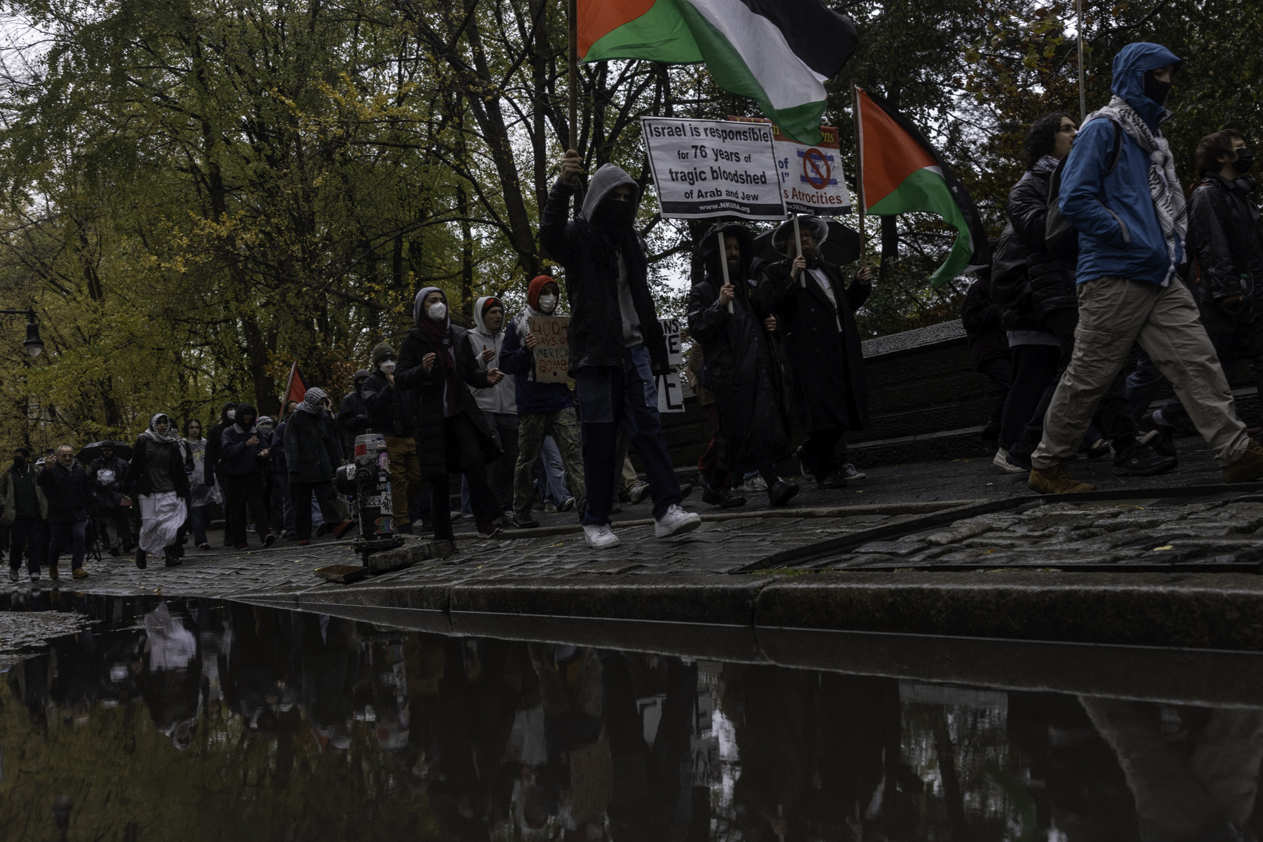 Students protest police presence on campus outside Gould Plaza wall