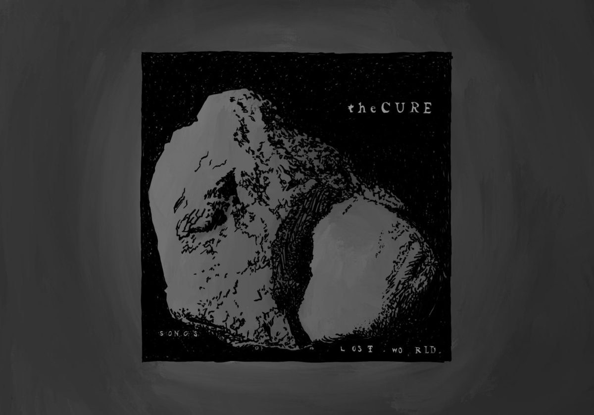 An album cover of a stone floating in an ether. The text surrounding the stone reads “the CURE”.