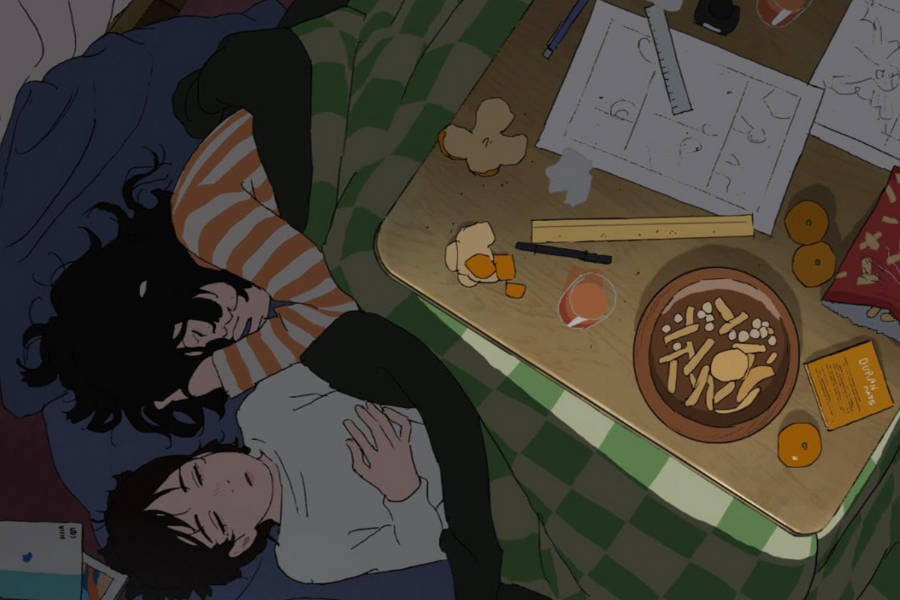 A still from an animated film depicting two characters sleeping under a kotatsu table. On top of the table are papers, rulers and half-eaten snacks.