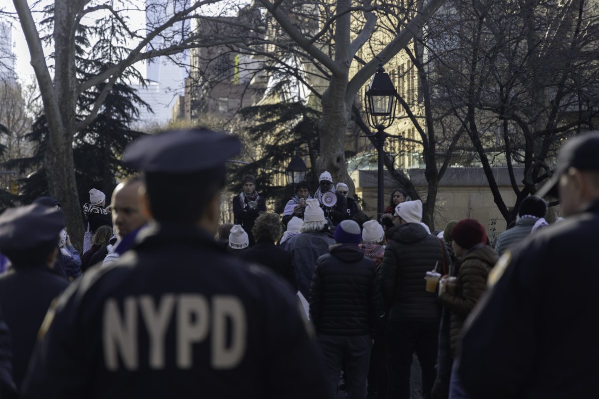 Members of the New York City Police Department look on during a pro-Palestinian rally in Washington Square Park on Wednesday, Dec. 18, 2024. (Danny Arensberg for WSN)