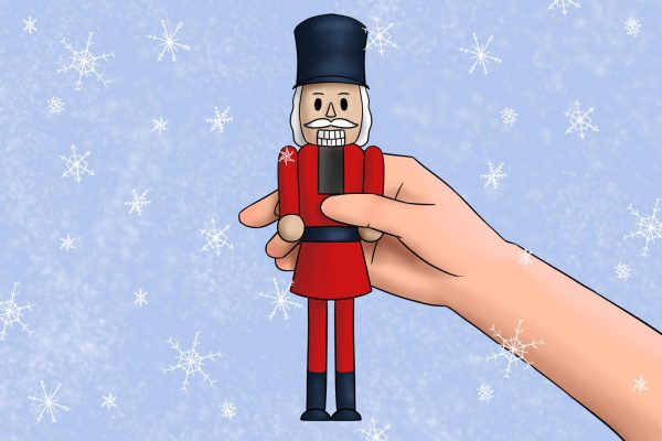 An illustration of a hand holding a nutcracker on a blue background scattered with snowflakes.