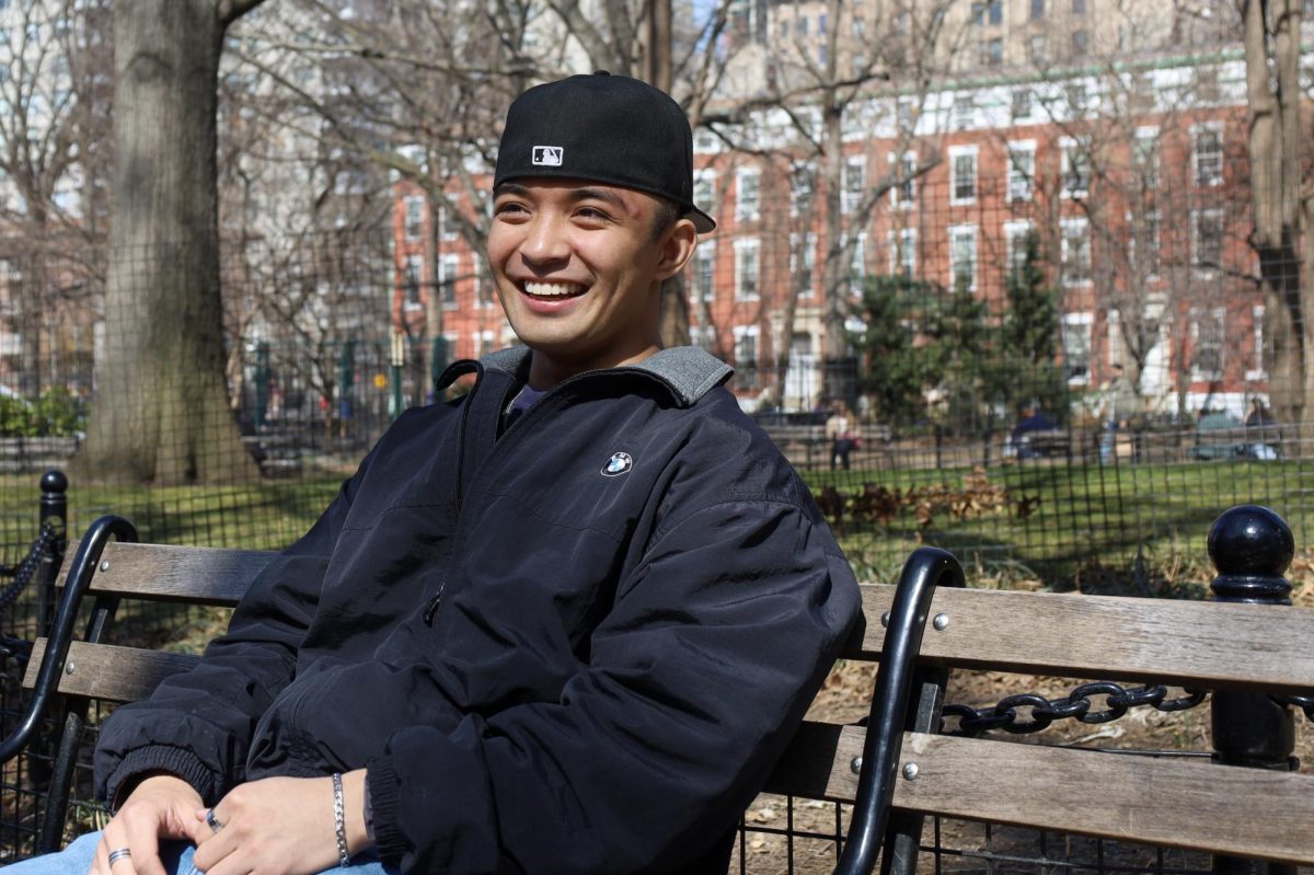 Benny Bautista, a senior in the NYU School of Professional Studies and co-captain of the wrestling team, in Washington Square Park. (Sidney Snider for WSN)