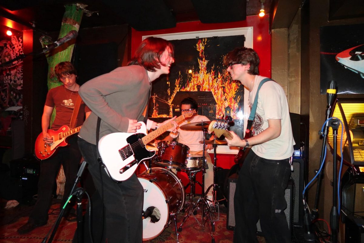 Aiden Mailley photographed on the left with the white electric guitar. (Courtesy of Olivia Federici)