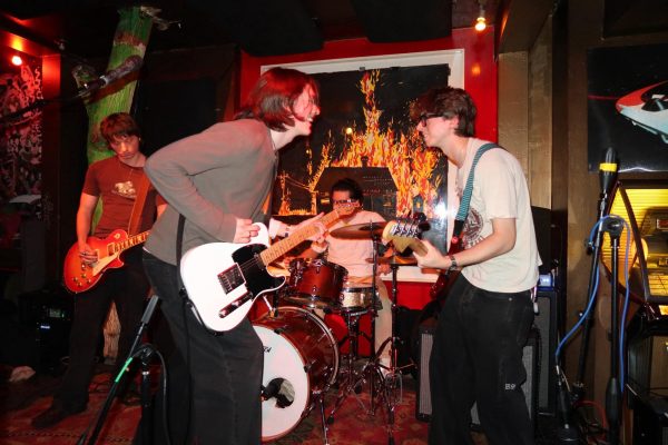Aiden Mailley photographed on the left with the white electric guitar. (Courtesy of Olivia Federici)