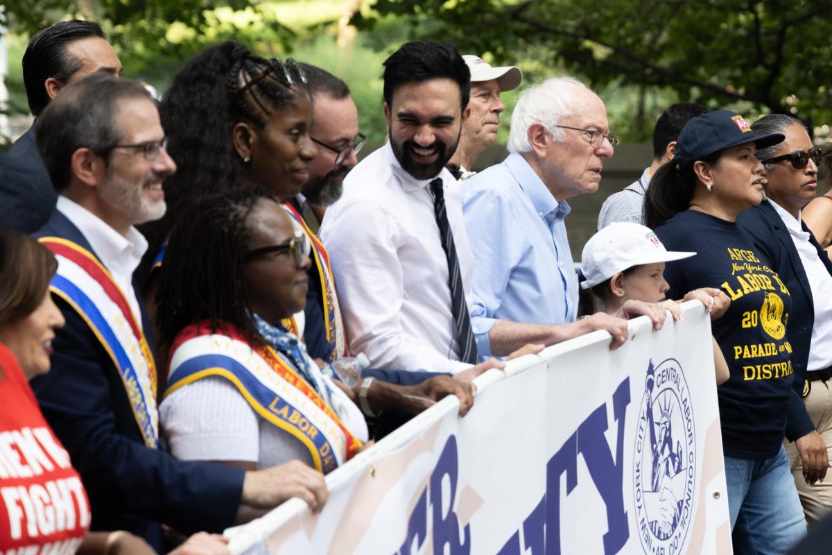 Zohran Mamdani stands beside Senator Bernie Sanders at this year’s Labor Day parade. (Krish Dev for WSN)