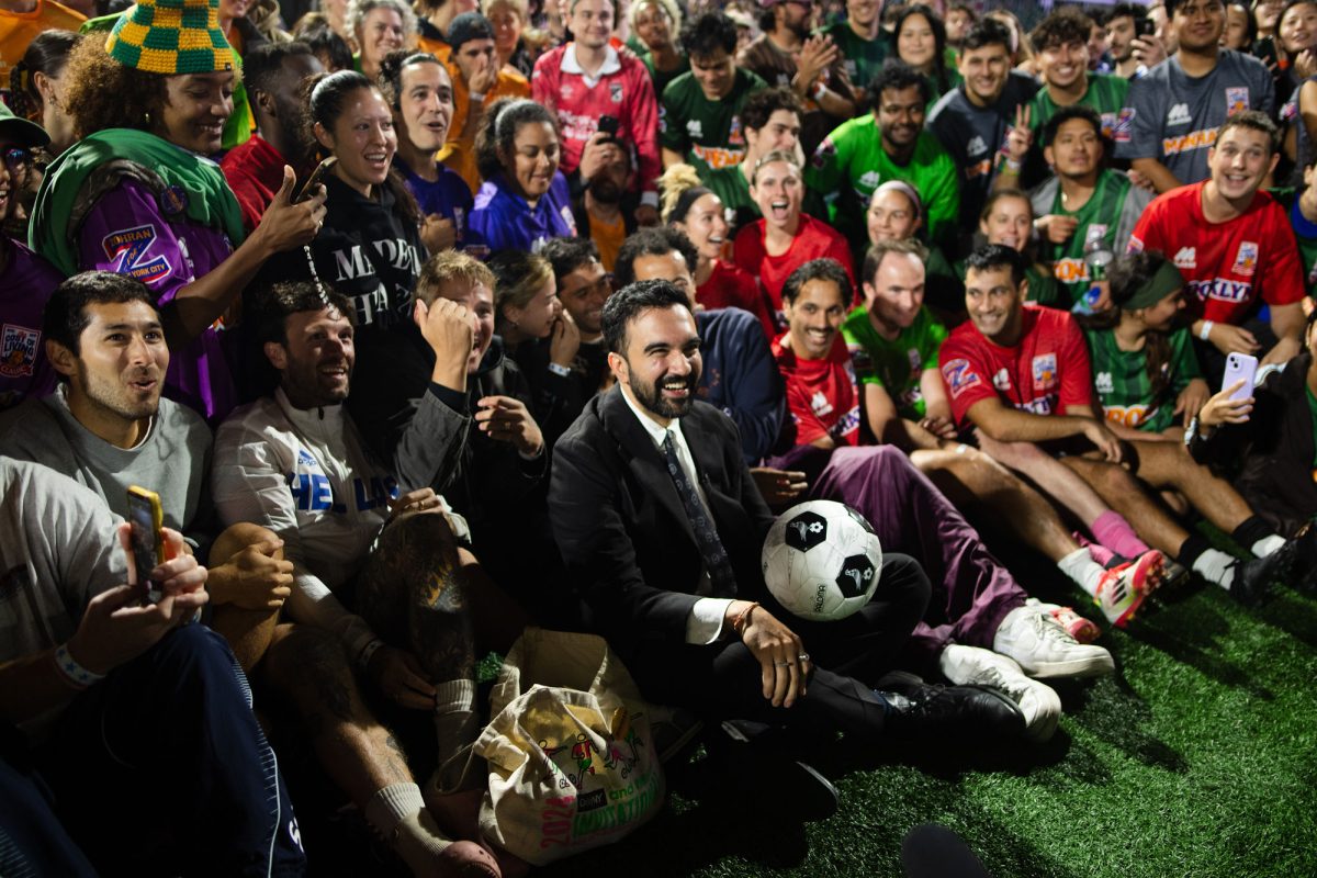 Zohran Mamdani posing for a photo with players and fans at the end of the Classic. (Evan D’Souza for WSN)