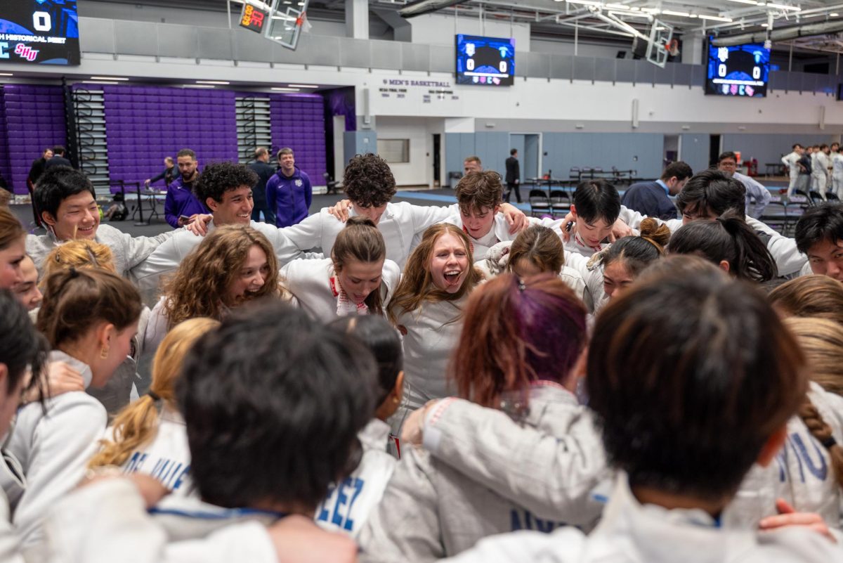 Senior Sophia Dondisch rallies the teams before facing Columbia University. (Kiran Komanduri for WSN)