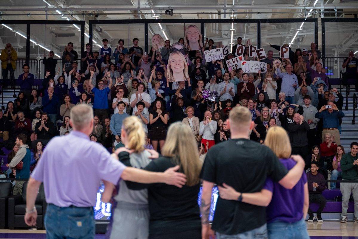 Senior Caroline Peper in front of her cheering squad.
(Kiran Komanduri for WSN)
