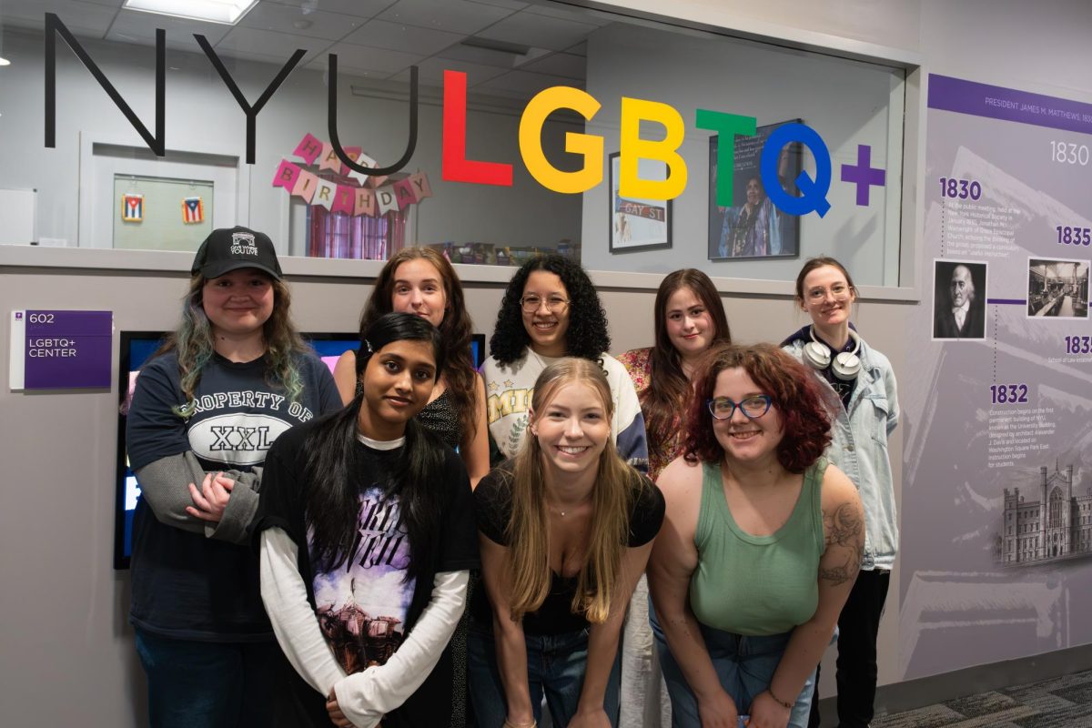 Members of CampGrrl’s e-board hosting a carabiner decorating event at the LGBTQ+ Center in honor of Lesbian Visibility Week. (Zara Surti for WSN)