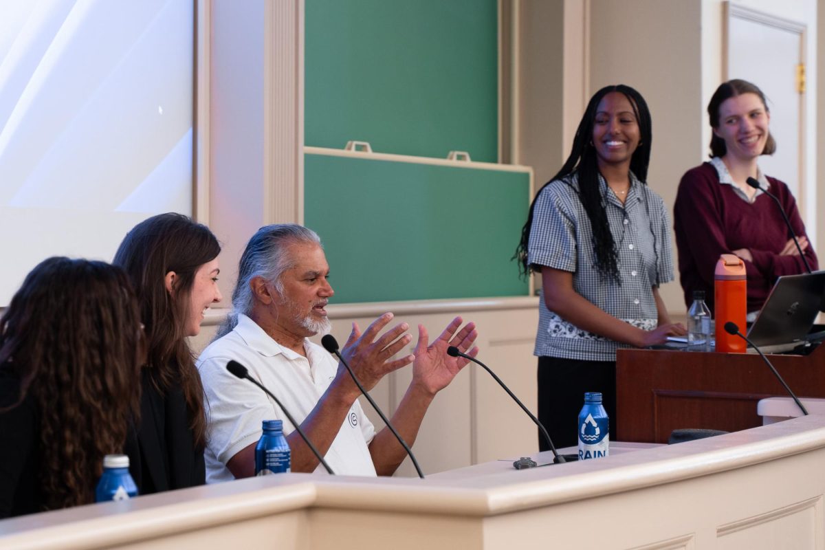 Activist Ravi Ragbir (center) speaks during the panel. (Alex Woodworth for WSN)