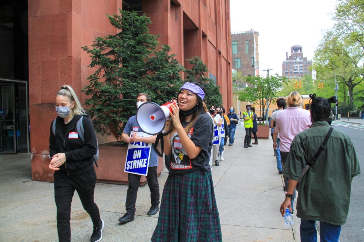 GSOC members and supporters picket outside Bobst Library during the union’s strike in April 2021. (Alexandra Chan for WSN)